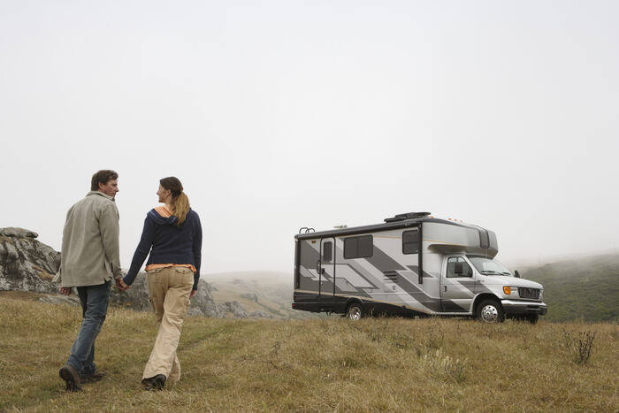 Couple walking to their RV